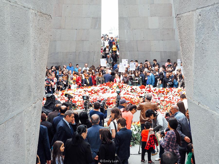 People place flowers at the Genocide Memorial in Yerevan, Armenia.