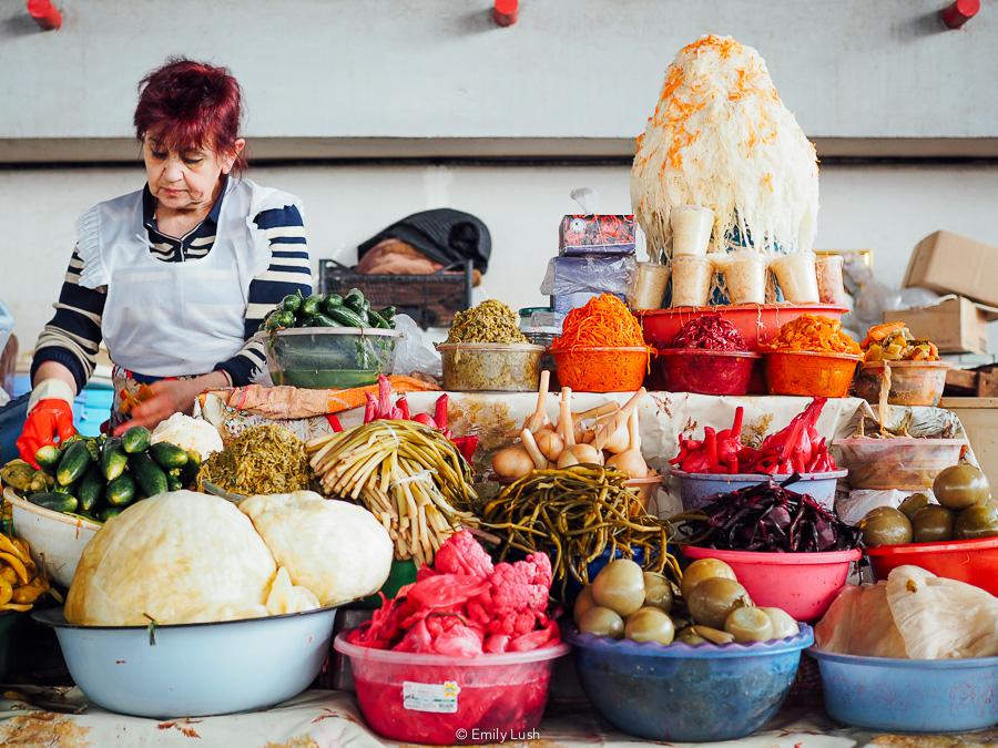 A woman sells brightly coloured pickles at the GUM Market in Yerevan.