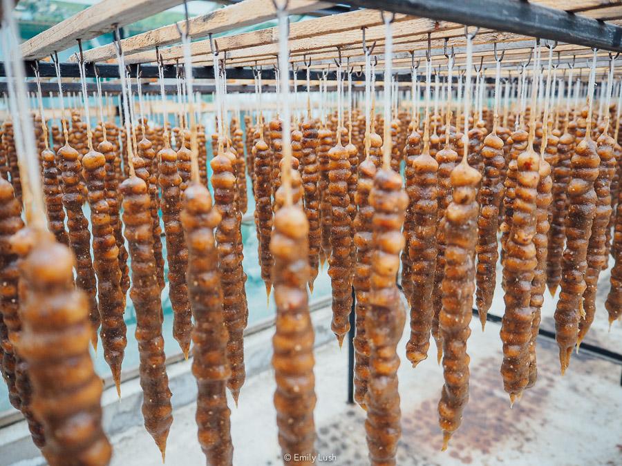 Churchkhela hanging on strings at a factory in Imereti near Kutaisi.