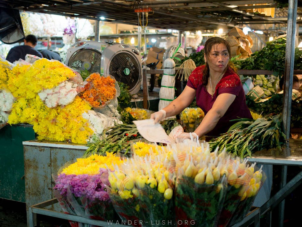 A female flower vendor at the Quang Ba Flower Market in West Lake, Hanoi.
