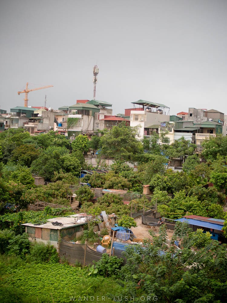 View of greenery and apartment houses from the Long Bien Bridge in Hanoi, Vietnam.