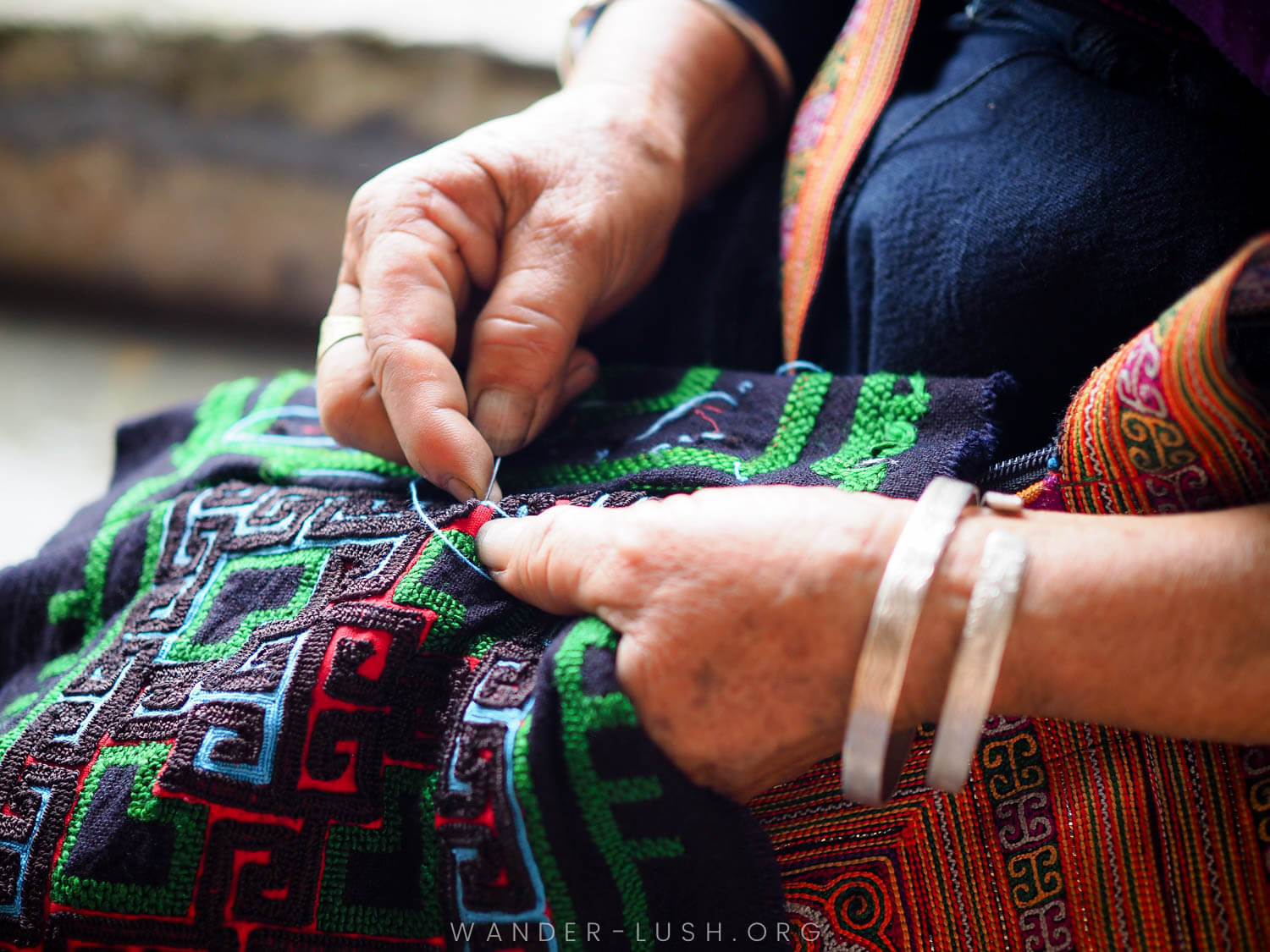 Practicing Hmong embroidery at a homestay in Sapa, Vietnam.