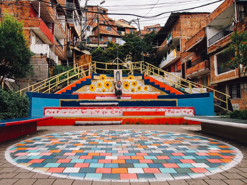 Thinking of visiting the Comuna 13 street art area? Here are 13 things you need to know before you sign up for a Comuna 13 tour in Medellin, Colombia.