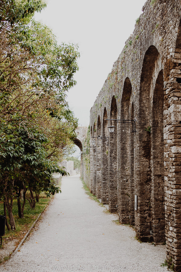 Tall stone arches at Gjirokaster Castle in Albania.