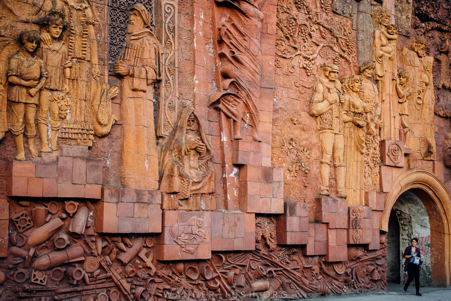 A large bas relief made from orange stone.