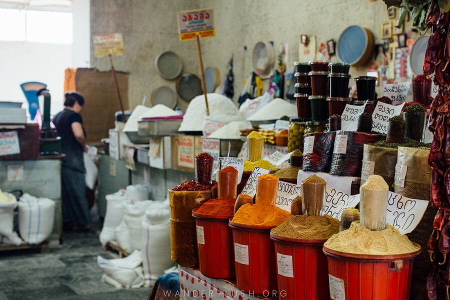 Buckets of vibrant spices at the Dezerter Bazaar food market in Tbilisi.