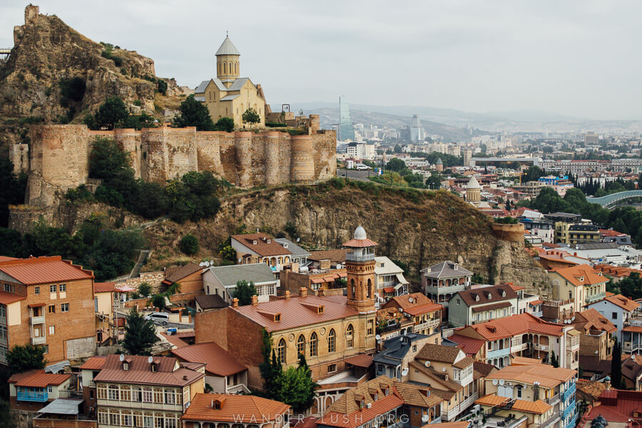 View of Tbilisi, with the colourful rooftops of the old town and Narikala Fortress – the best city to visit in Georgia.