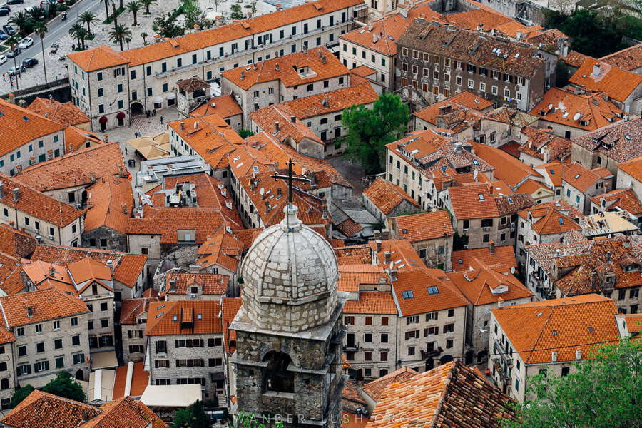 Orange roofs of Kotor Old Town, one of the most beautiful places in Montenegro, viewed from above.
