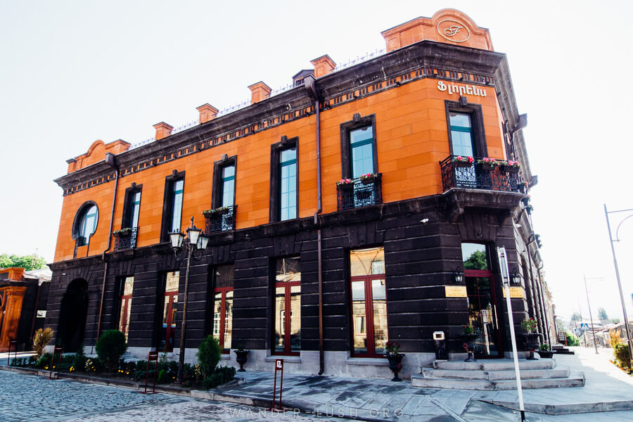 An orange and black stone building.