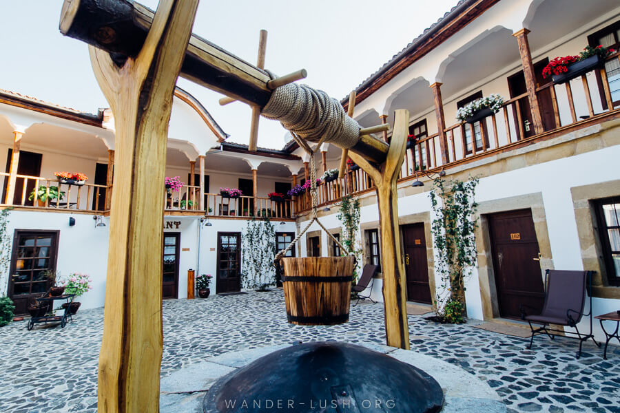 A well at the centre of a historic inn.