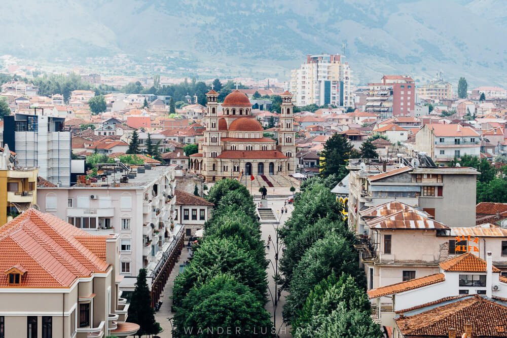 A city and large church with tree-lined streets, Korca Albania.