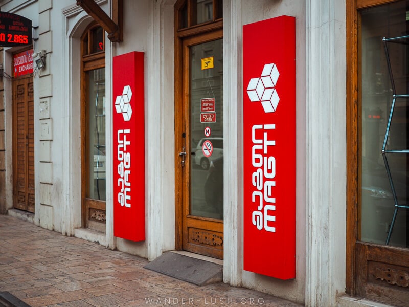 A shopfront in Tbilisi with Magti sim card company branding.