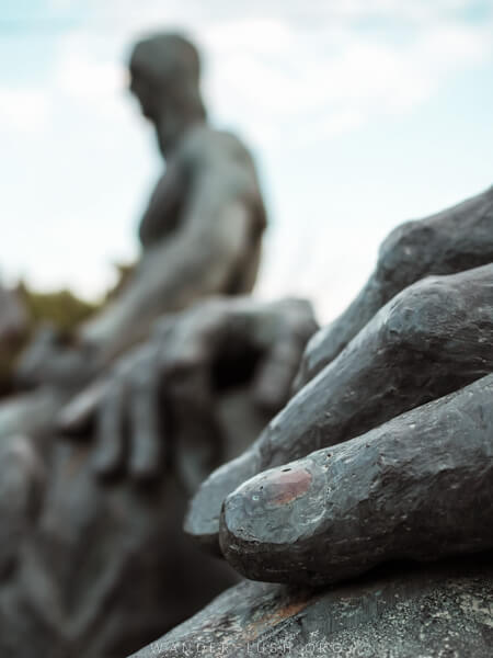 Close-up on the hand of a sculpture.