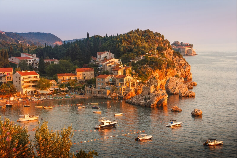 A fishing town perched on a rocky cliff in Montenegro.