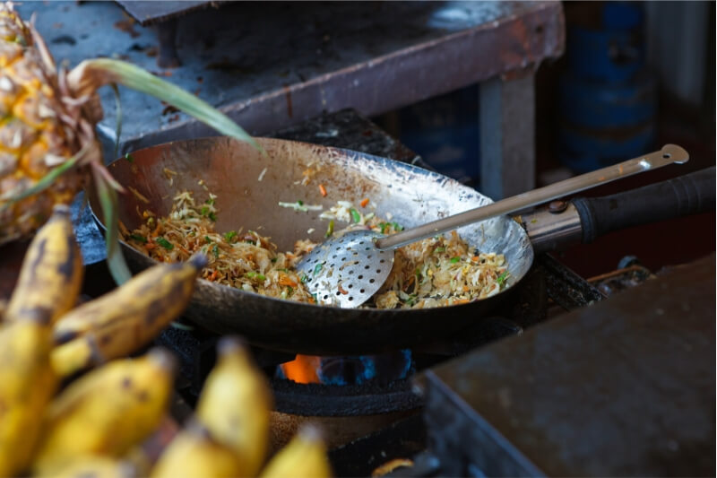 Making Sri Lankan food in a traditional frying pan.