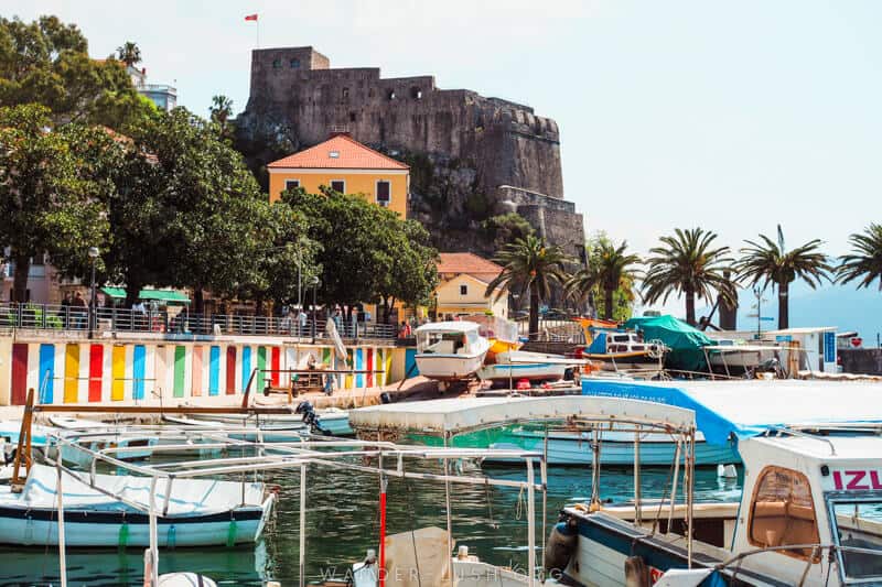 A stone castle and a colourful harbour at Herceg Novi in Montenegro.