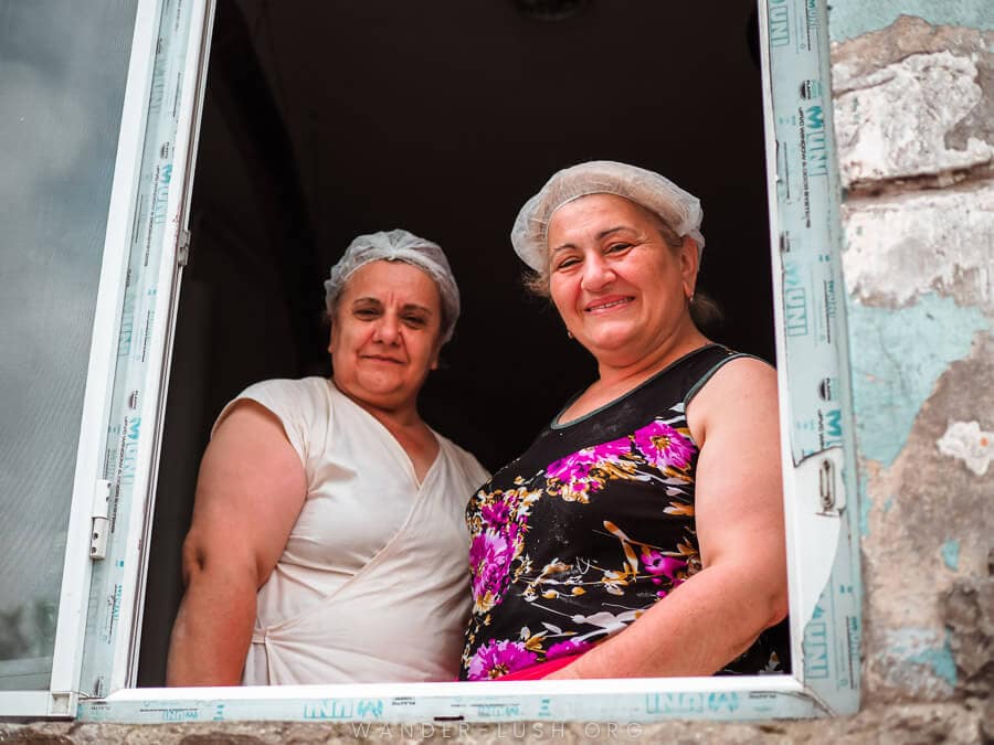 Two women smile for a photo at a restaurant in Batumi, Georgia.