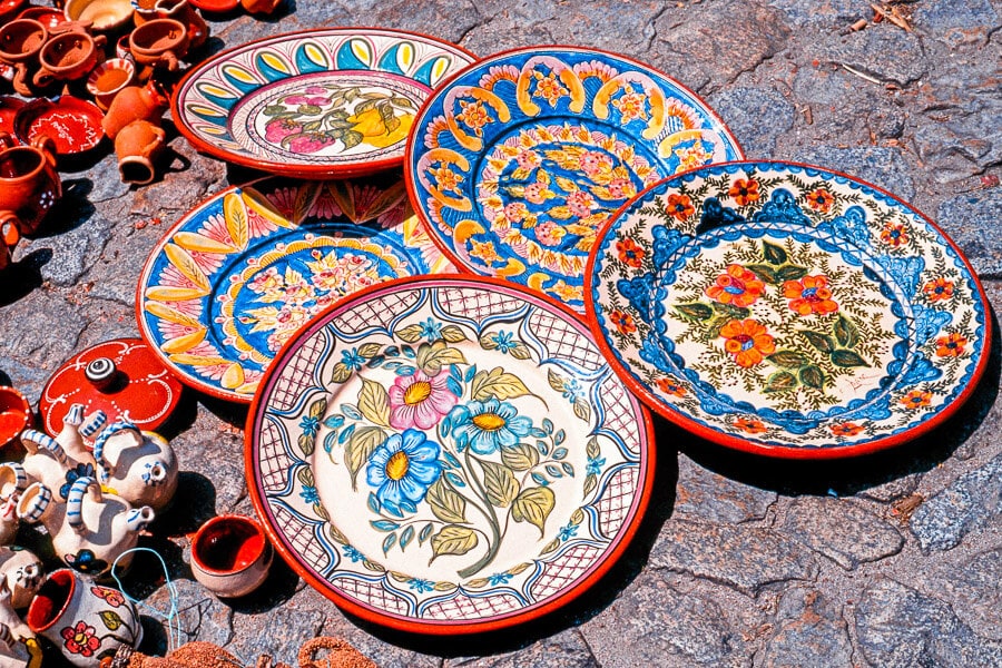 This colourful set of Portuguese ceramics decorated with floral motifs is a wonderful souvenir to buy in Portugal.