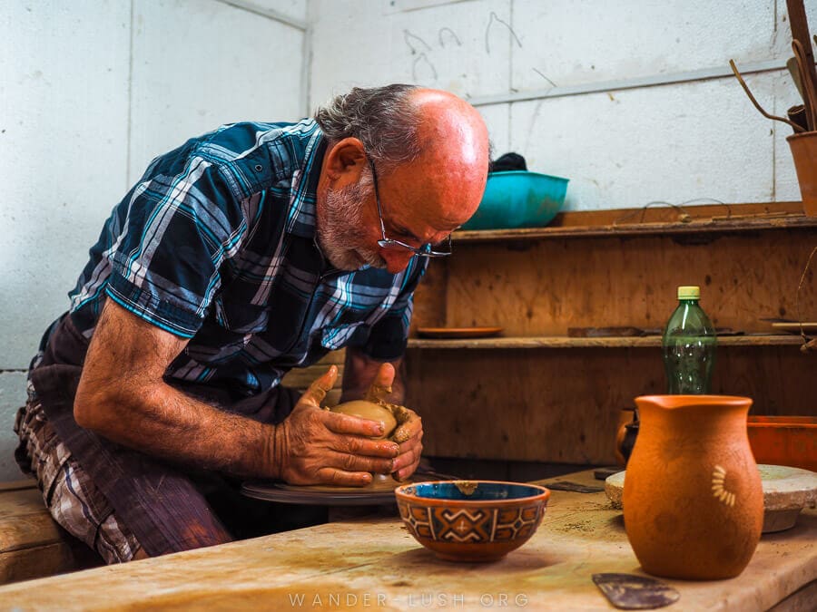 Artist Robert Absandze works a pottery wheel at ORKOL Studio in Zugdidi.