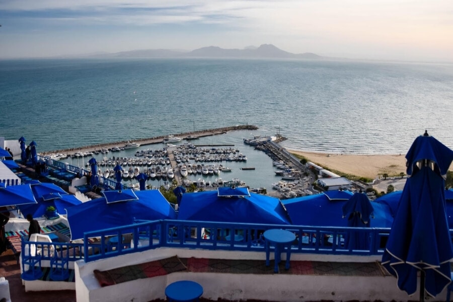 Beach umbrellas and a marina in Northern Tunisia.