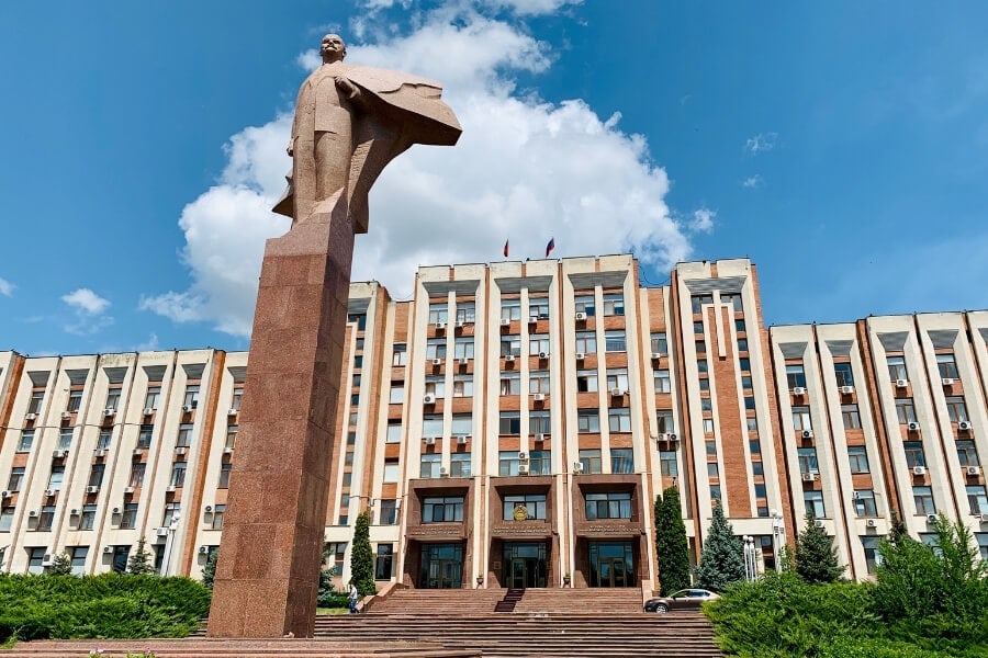 A Lenin statue in front of a Soviet-style building in Transnistria.