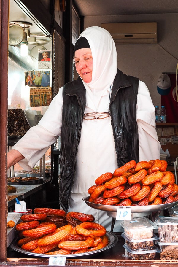 A vendor sells donuts in the Skopje Old Bazaar.
