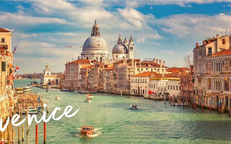 Venice, the most beautiful city in Italy, pictured from a classic angle with a full view of the canals and historic architecture.