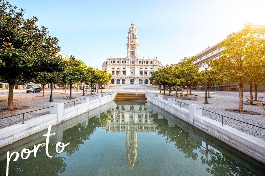 A beautiful historic building reflected in a waterway in the centre of Porto, Portugal.