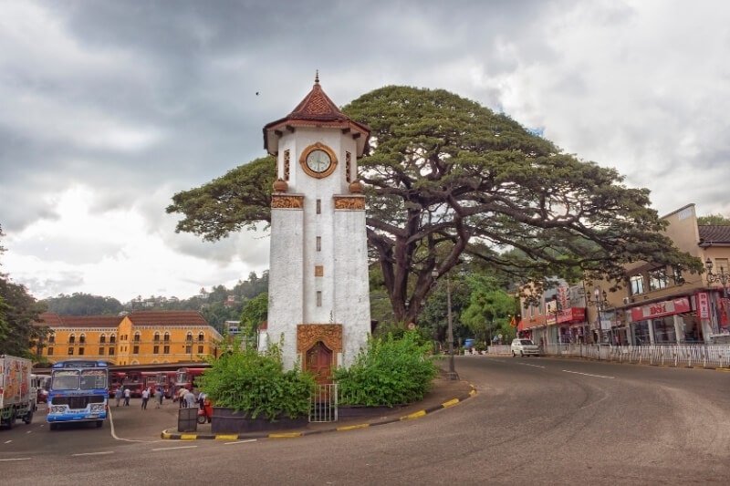 An unusual clock tower stands at the junction of two roads in the Sri Lankan city of Kandy.
