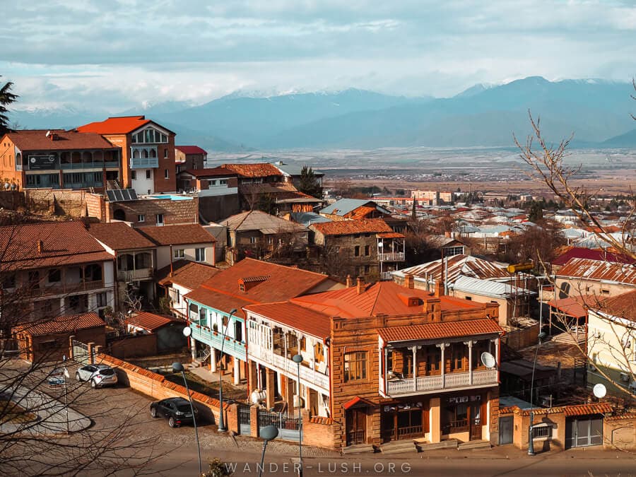 A bird's eye view of Telavi city, featuring heritage buildings and rusted iron roofs.