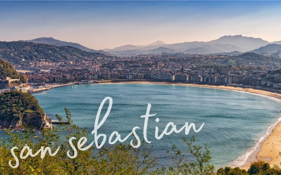 A view across the bay of San Sebastian, a sprawling city of resorts and hotel buidings.