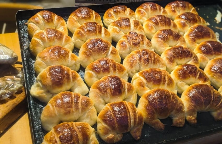 A tray of crescent-shaped facturas in Argentina.