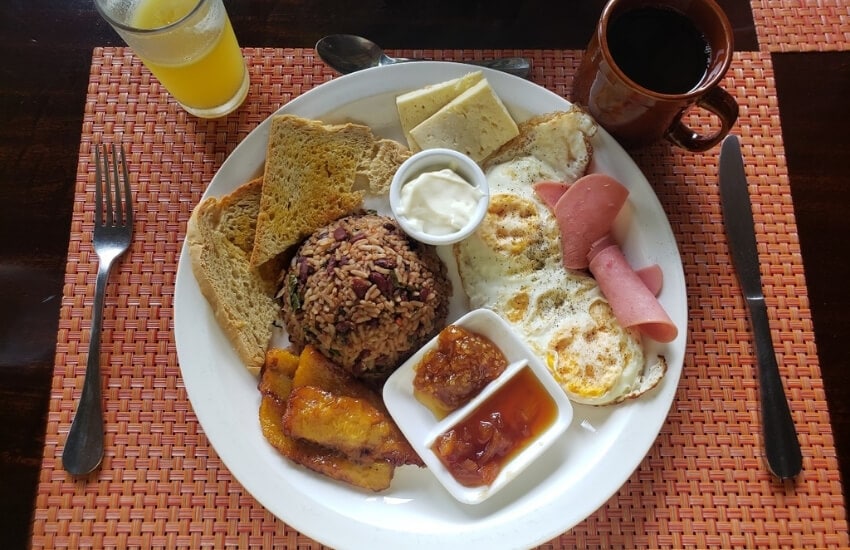A traditional breakfast dish in Costa Rica, with rice, eggs and coffee.