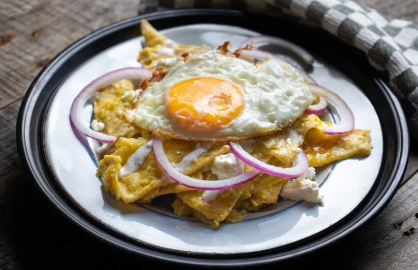 A plate of chilaquiles with a fried egg on top.