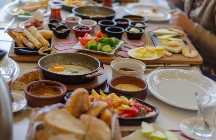 A traditional Turkish breakfast spread, with dozens of small dishes served in the middle of the table.