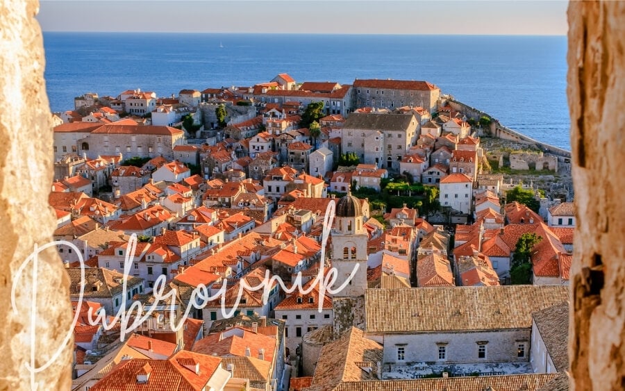 Peeking through a stone portal to view the old town of Dubrovnik.