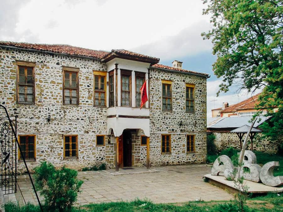 A traditional stone building houses the First Albanian School in Korca.