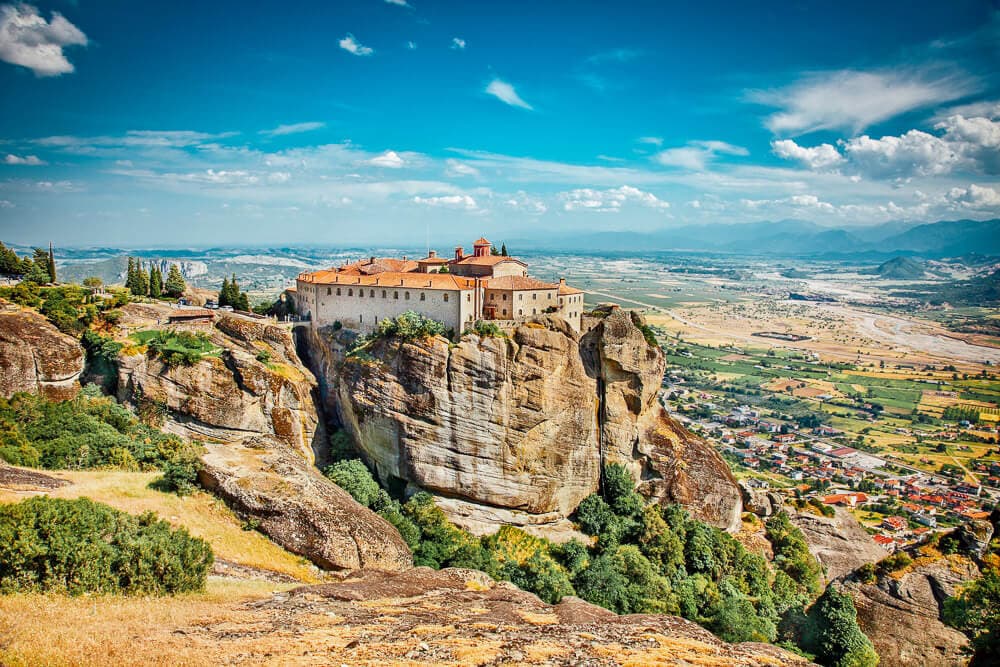 A monastery sits atop a striking rock formation in Meteora, Greece.