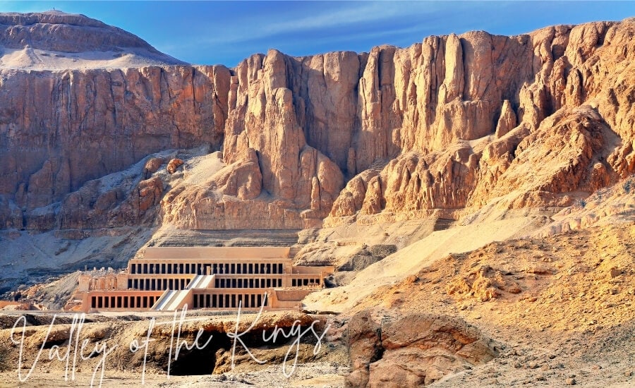 Dramatic cliffs form a backdrop to an archaeological site in Egypt's Valley of the Kings.