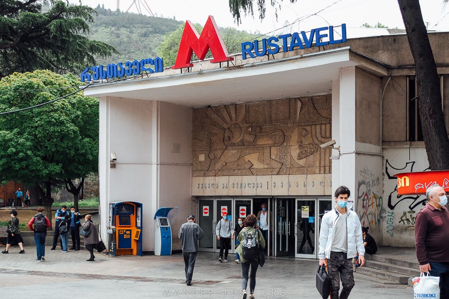 People walk out of Rustaveli Metro Station in Tbilisi.
