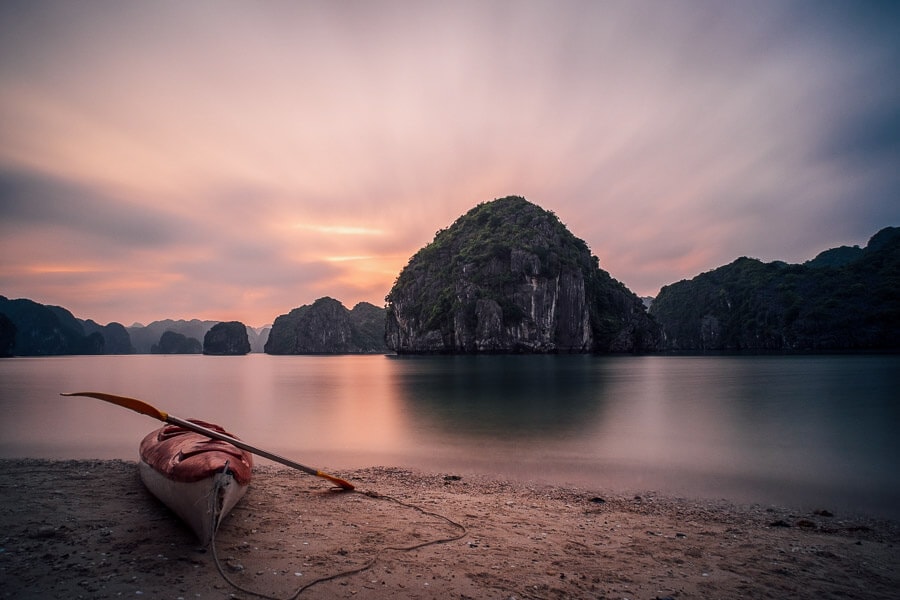 A lone kayak sits on a beach in Lan Ha Bay.