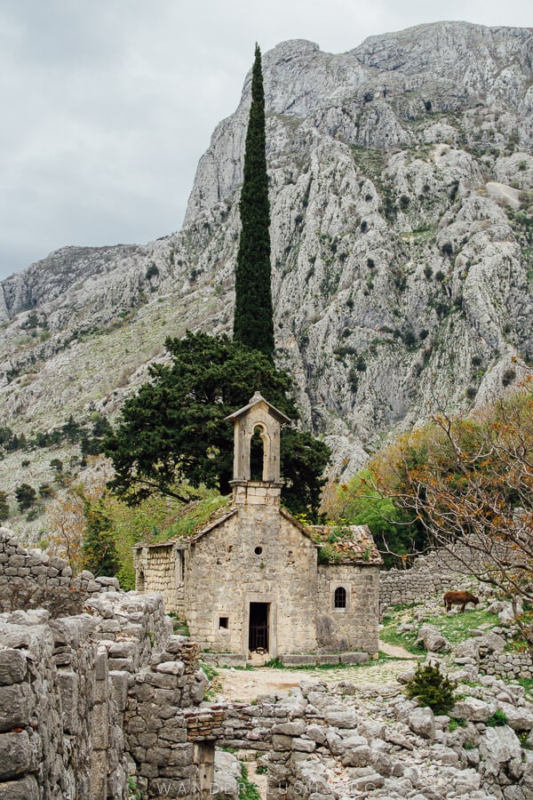 A stone church in the forest on the hiking trail to Kotor Fortress.