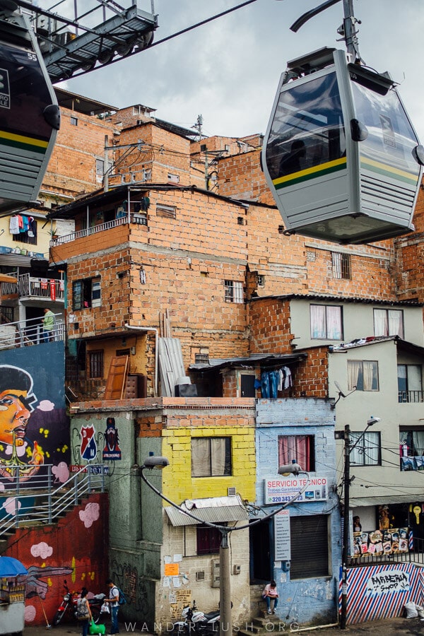 A gondola runs past colourful buildings in Medellin.