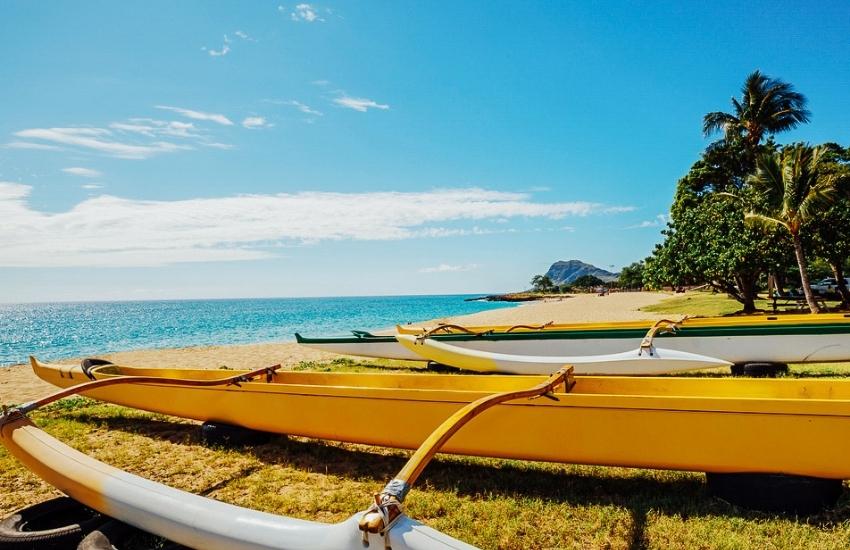 Outrigger canoes on the beach in Hawaii.