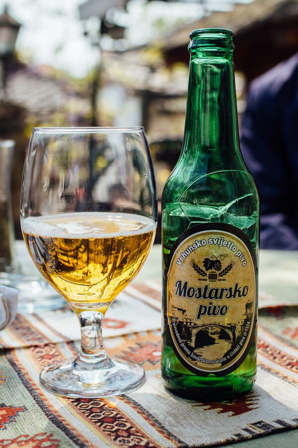 A bottle of Mostar beer on a table in Mostar, Bosnia.