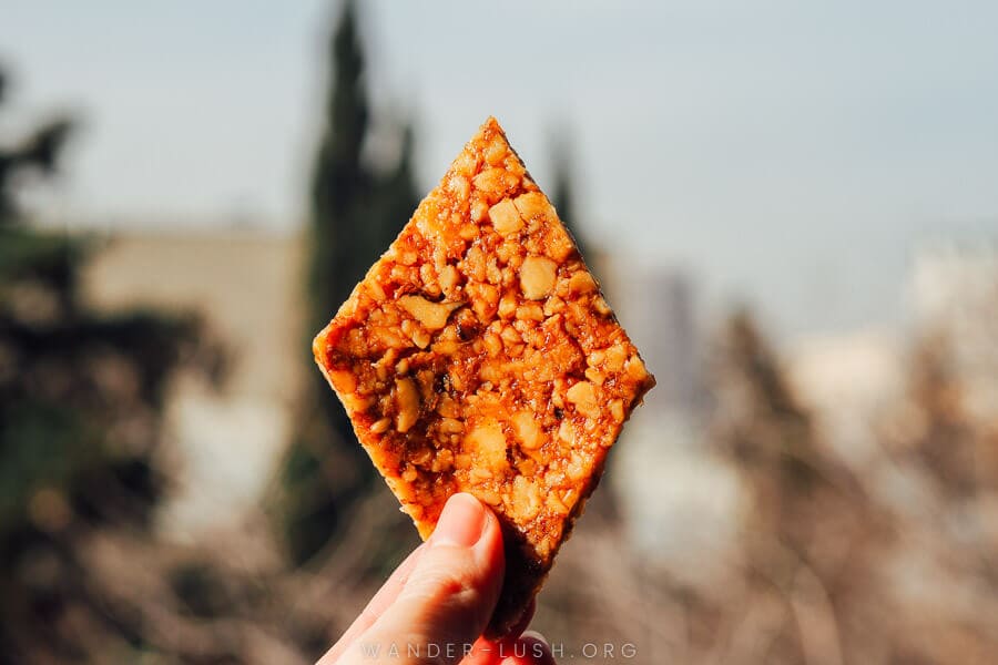 A diamond-shaped piece of Gozinaki, a Georgian dessert made from walnuts and honey and eaten at Christmas time.