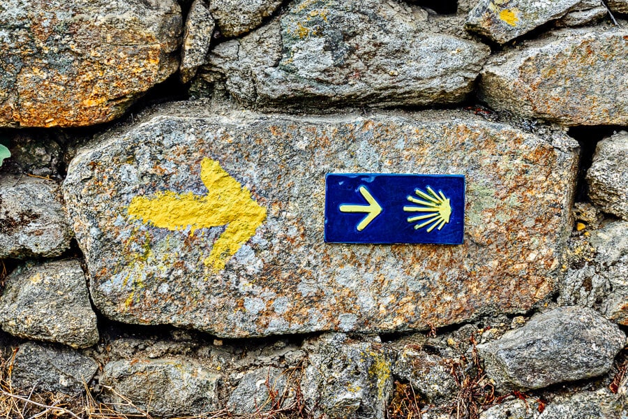 Yellow shells and arrows mark out the Portuguese Camino trail.