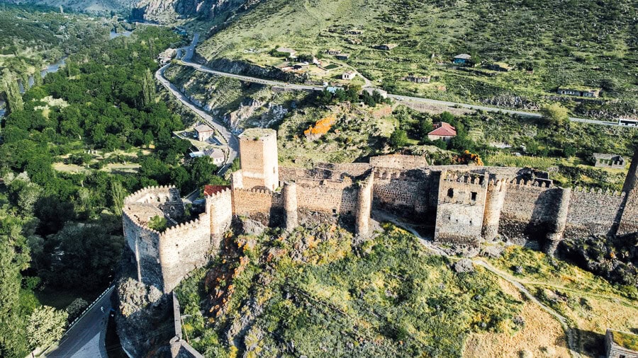 An aerial view of Khertvisi Fortress, an impressive castle above the river valley in southern Georgia.