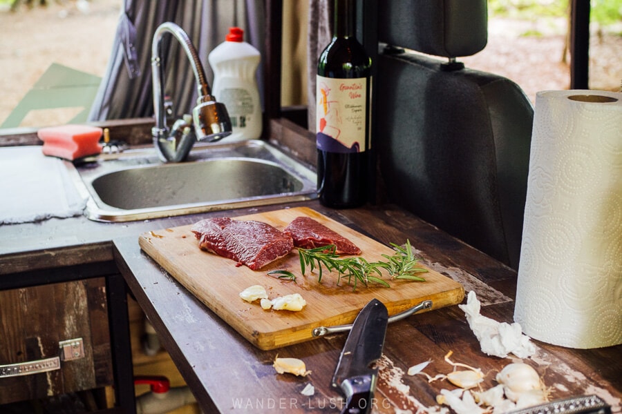 A small kitchenette inside a camper van.