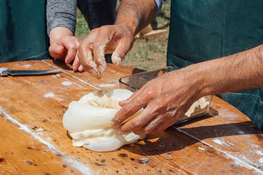 A man prepares Kada, a traditional Georgian pastry dish.